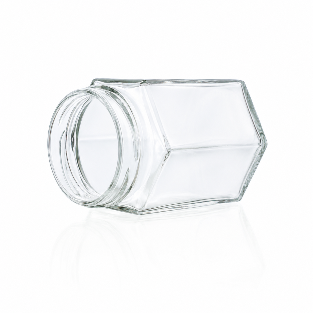 Sechskantglas 195 ml TO 58 aus klarem Glas mit sechs geraden Seitenflächen und Twist-off-Mündung, seitlich liegend dargestellt.